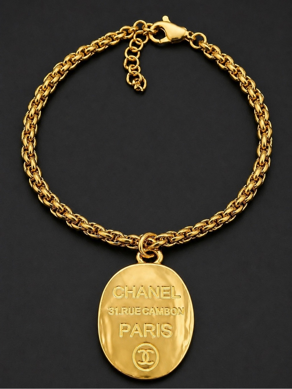 Chanel EUC CC Paris gold tone 
Hammered logo Bracelet 
7” Cuban stainless Chain
